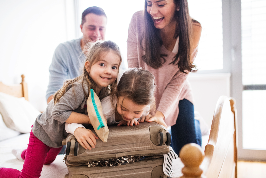 Family packing a suitcase